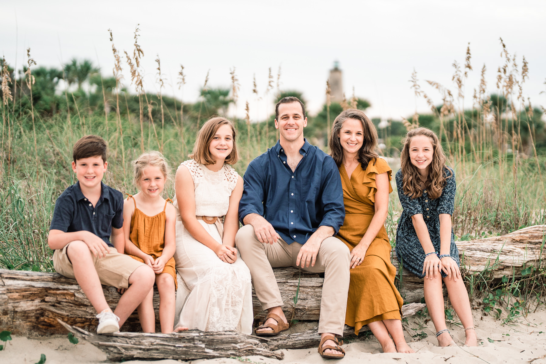 Wilmington NC Family Photographer - Family Photography - Family Portraits - Photo of Family on the beach - What to wear for family photo session ideas - Wilmingotn NC Family Photography - Chris Lang Photography