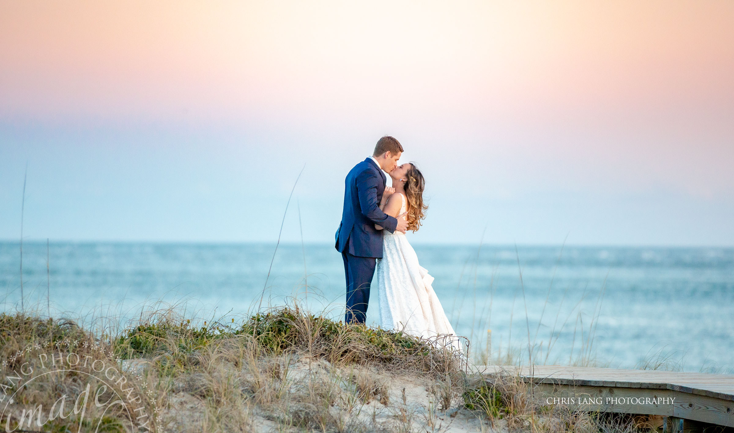 Bald Head Island Wedding picture - bride and groom on the beach at sunset  - twilight wedding picture -- Shoald Club -  Photo inspiration - Atlantic Ocean - Chris Lang Photography