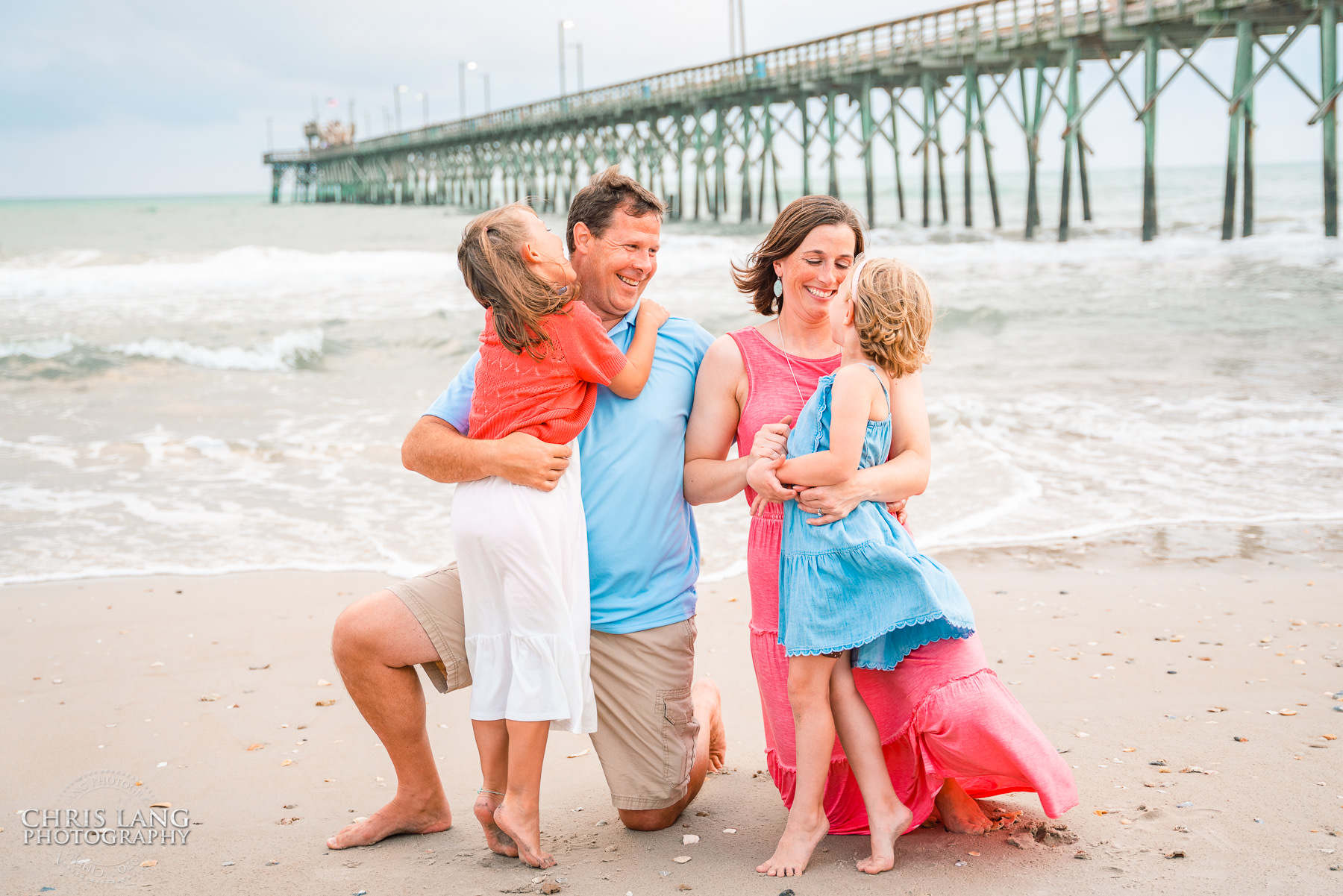 Image of family on Topsail isand at the beach having fun - Topsail Island Photographers -  Topsail Photography - beach Photo Session - Surf City Pier - Chris Lang Photography