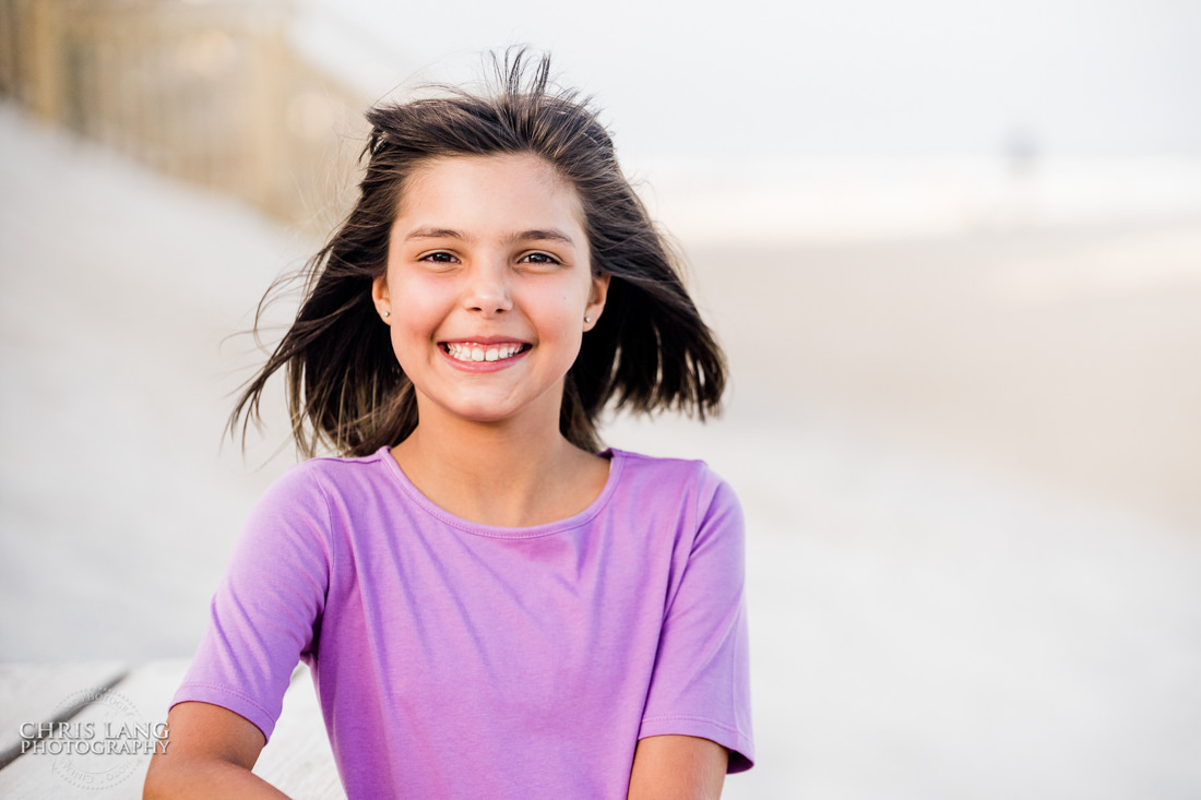  Young girl smiling for picture at the beach -Topsail Island Photography - Topsail Island NC Photographers - Chris Lang Photography -  Beach Photography - Family Photographer - Family photo - Beach Photographer - Beach Portraits -  Coastal Lifestyle Photography
