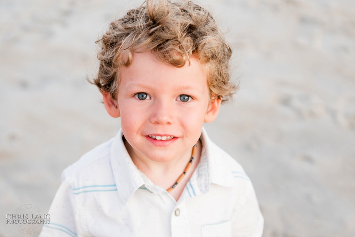 Young boy posing for picture on the beach  - Topsail Island Photography - Topsail Island NC Photographers - Chris Lang Photography -  Beach Photography - 