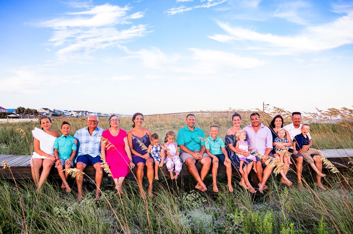 Family sitting on beach walkway - large family portrait - family portraits - family picture - family photography - wilmington nc family photogrpahers - chris lang photography