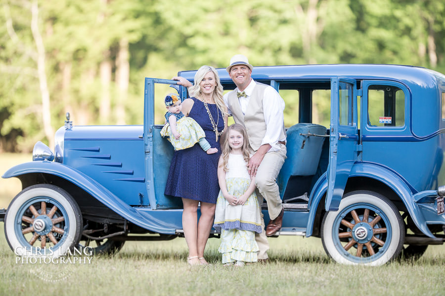 Wilmington  NC Family Photographers - Family Photography Service - Family Picture - Family Portraits - Family posing in forn of an old classic car for a stylezed family session - 