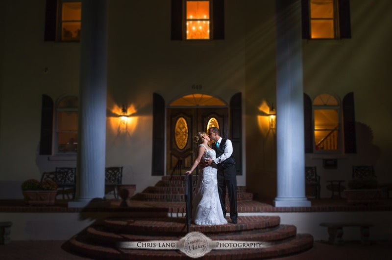 Nght time wedidng picture of newlyweds kissing under the moonlight.  Nighttime wedding photograpy. Wedding picture ideas.  Wilmington NC Wedding Photographer