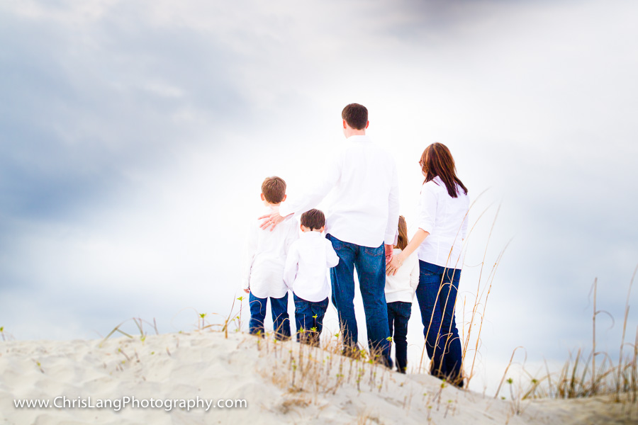 family having a lifestyle portrait session at the beach