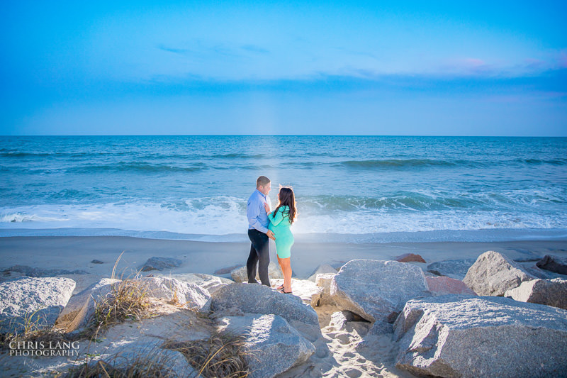 maternoty photo of couple on the beach at sunset.  ft fisher - maternity photo - chris lang photography