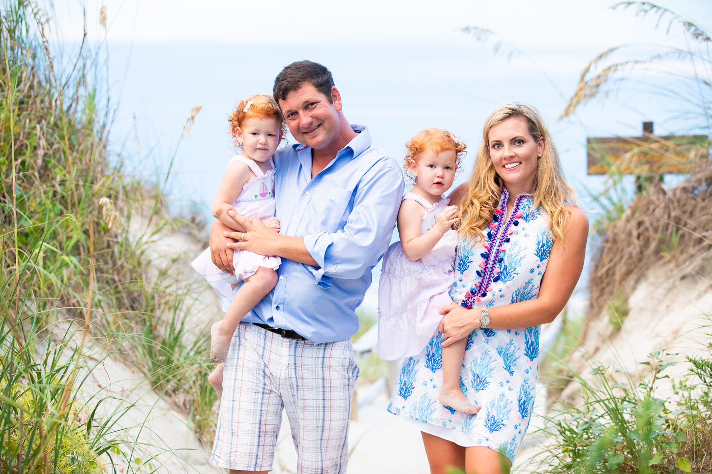 figure eight island - amily portrait photography - wilmington nc family portrait photpgraphers - image of family on beach - sunset family picture -  chris lang photography