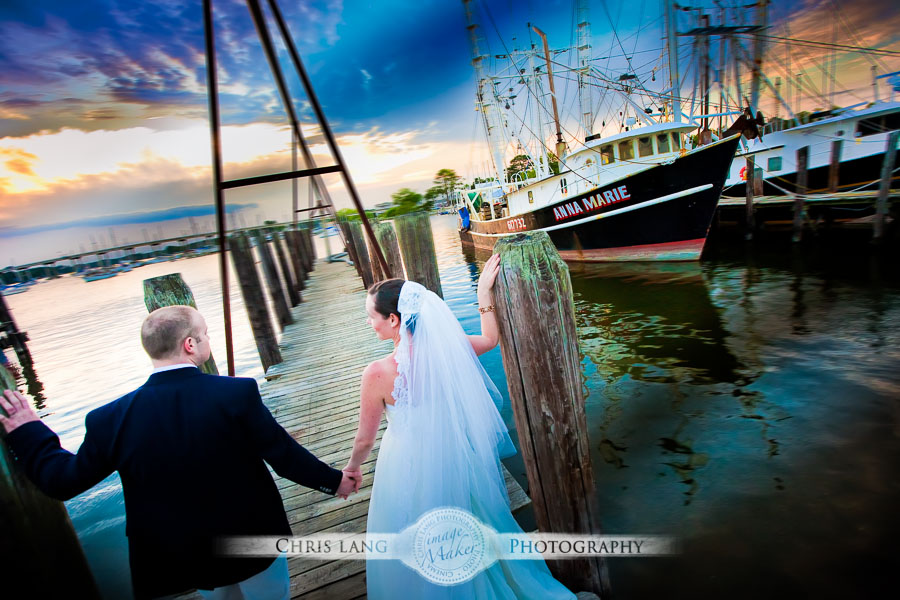 Image of wedding couple on a dock by the intercoastal waterway.