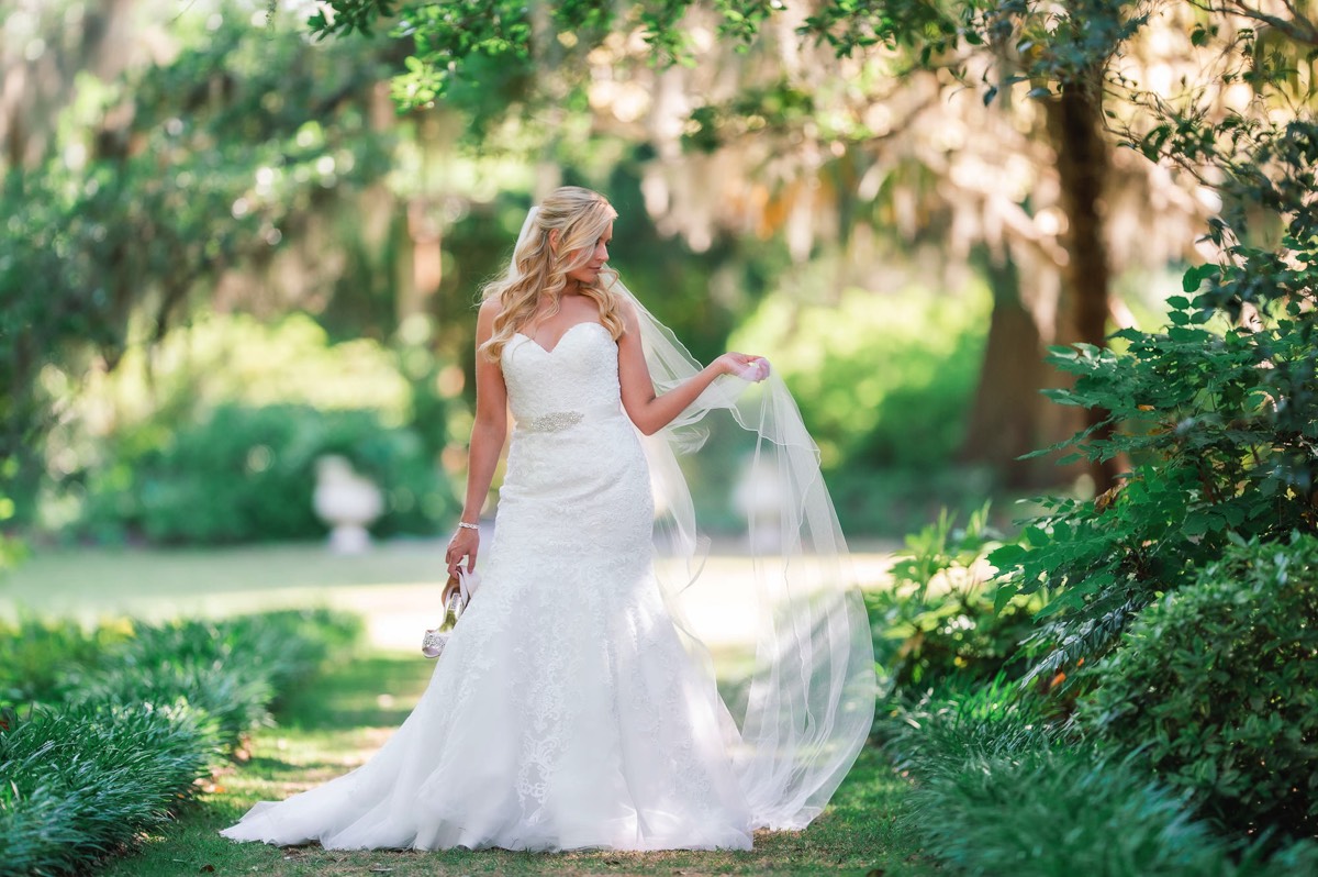 Bride posing in Airlie Gardens - Bright & airy wedding photo - bridal portrait - bride- wedding dress - Wilmington NC Wedding Photographer  - Chris Lang Photography  