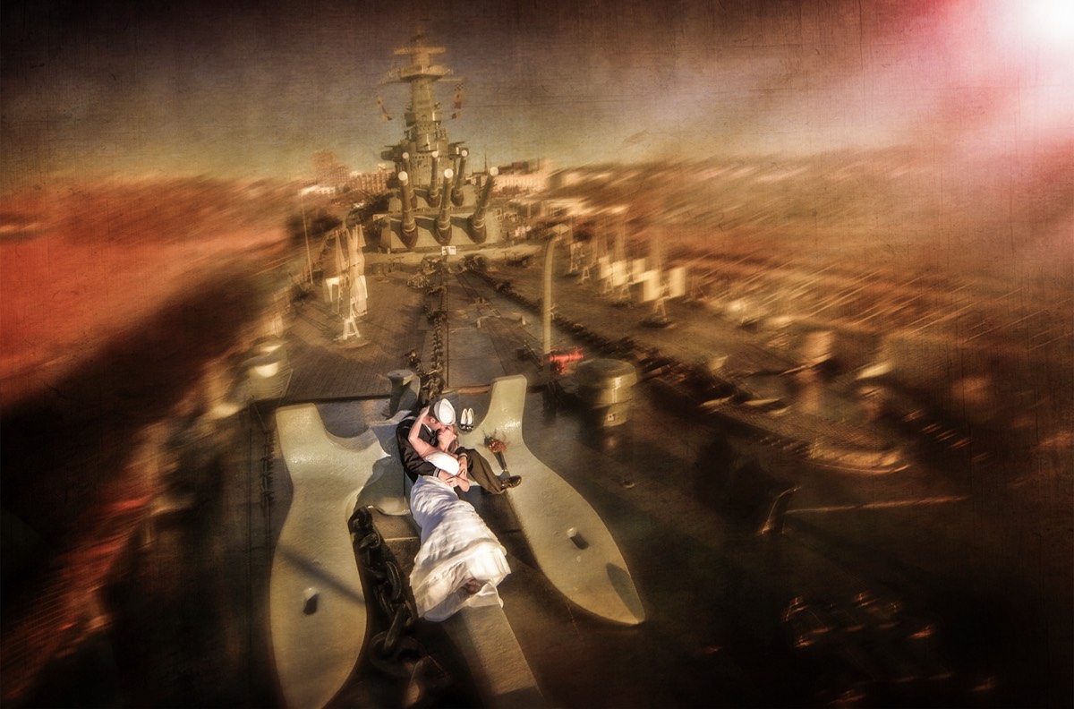Bride & groom on the battle ship north carolina - wilmington nc wedding photographers - creative wedding photo - signature portrats - wedding ideas - bride - groom - wedding dress - chris lang photography