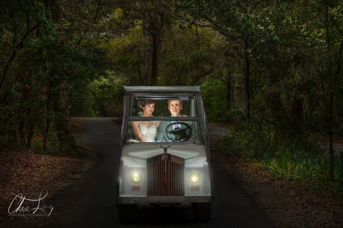 bride and groom in golf cart- wilmington nc wedding photographers - creative wedding photo - signature portrats - wedding ideas - bride - groom - wedding dress - 