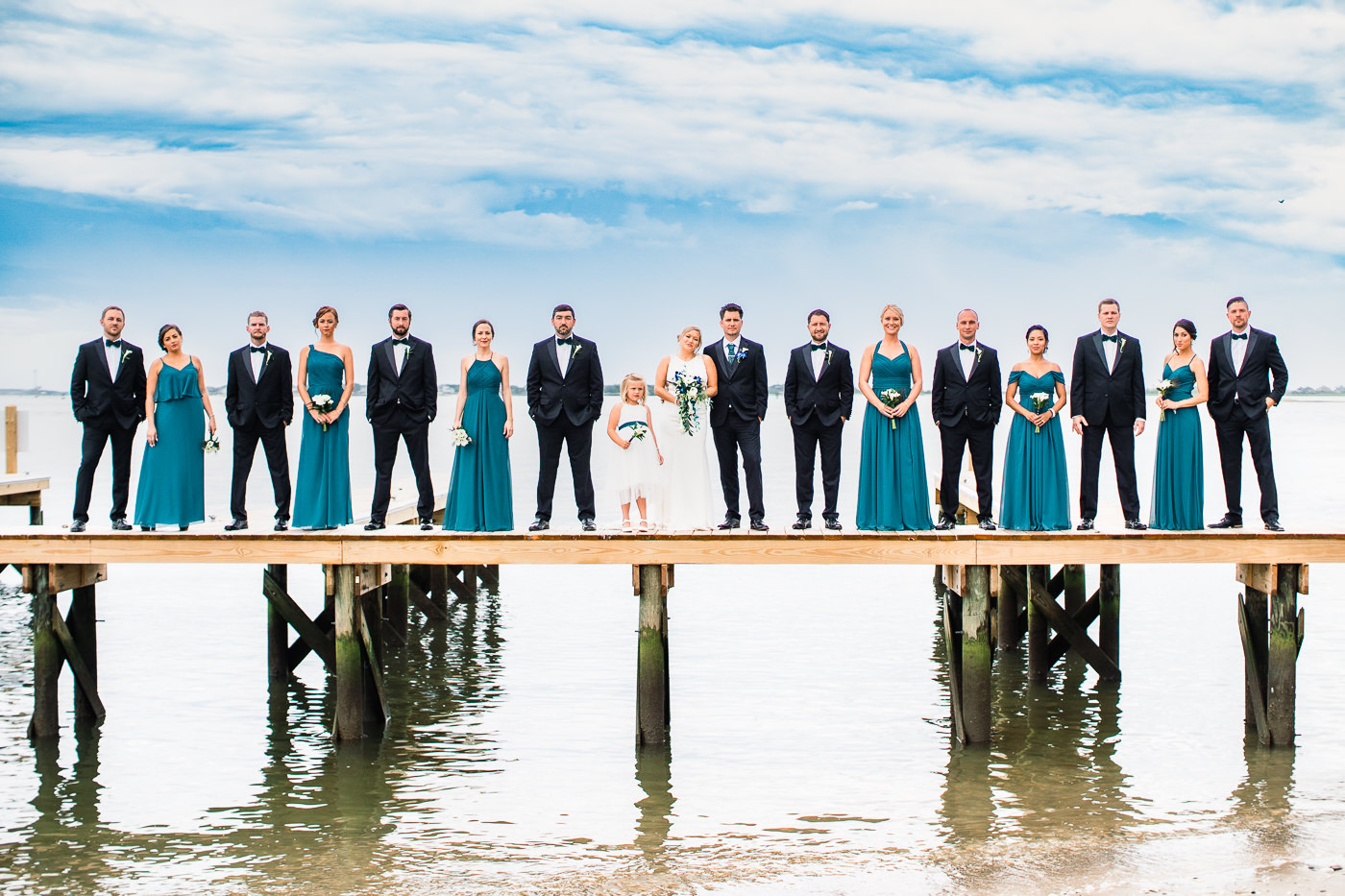 Lifestyle wedding photo of bridal party on a dock - cape fear river - wedding photography - Wedding Ideas -Wilmington  North Carolina Wedding Photographers 