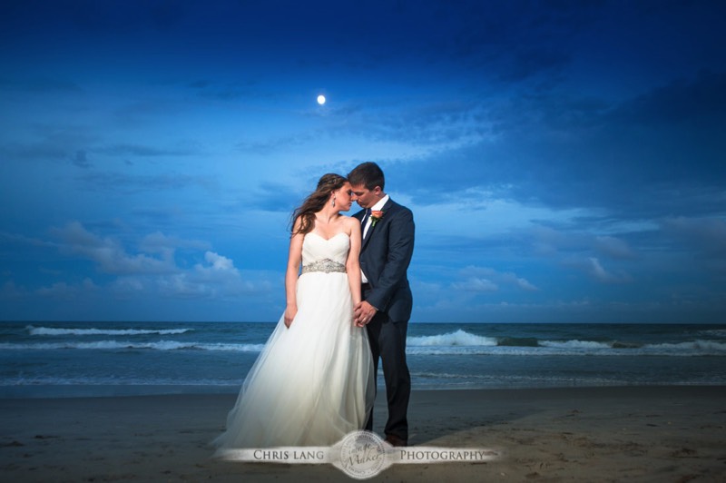 A wedding image of a bride and groom on the beach at Shell Island Resort enjoying the beach during sunset. Wilmingotn Wedding Photographer