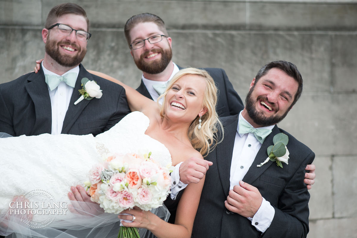 bride being held by groomsmen - fun wedding photo- Wilmington NC Wedding Photographer - Wedding Photography - Wedding Photo - Chris Lang Photography