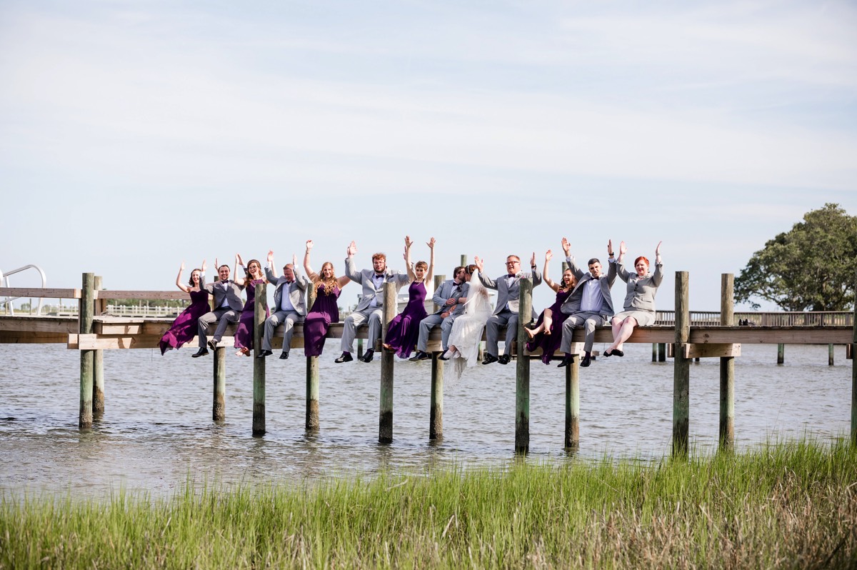 Photo pf bridal part sitting on a dock - intercoastal waterway - - Wilmington NC Wedding Photographer - Wedding Photography - Wedding Photo - Chris Lang Photography